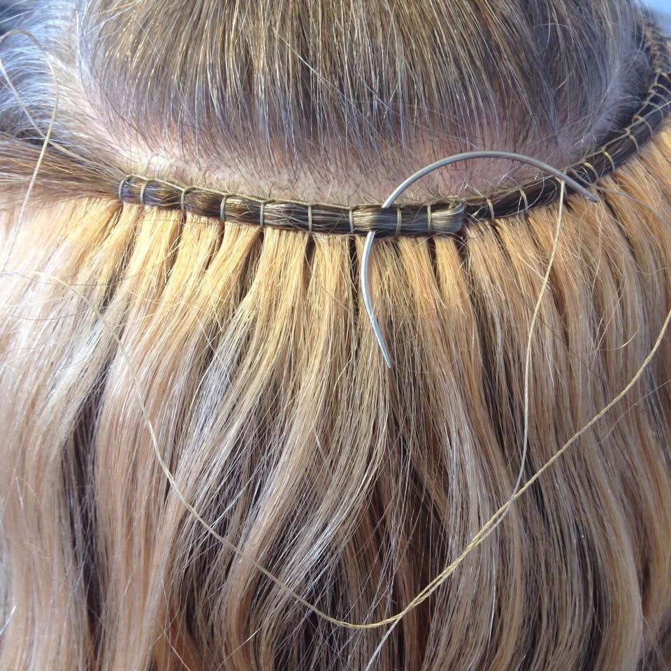 Close-up of a weft extension installation